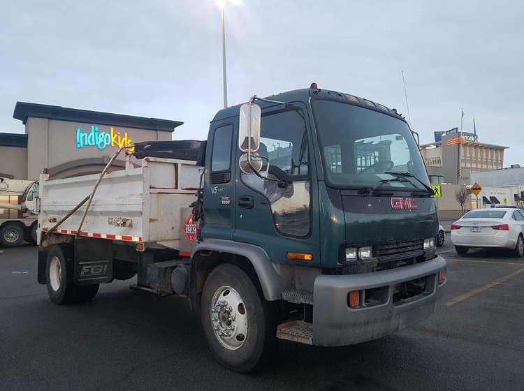 The green GMC dump truck we unlocked, parked outside Chinook Mall in Calgary
